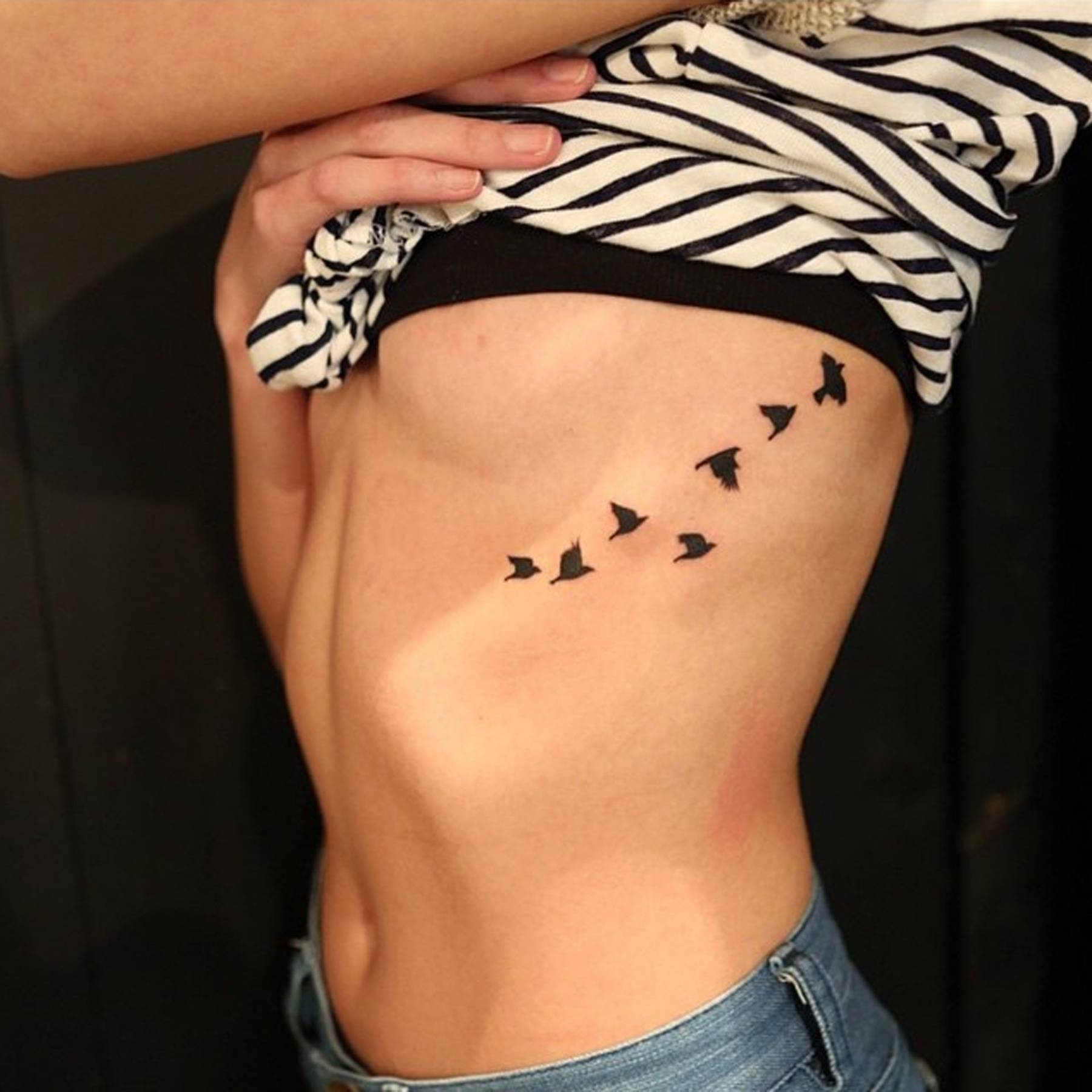 dainty stomach tattoos