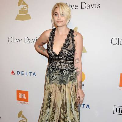 Paris Jackson poses topless and reveals newest tattoo